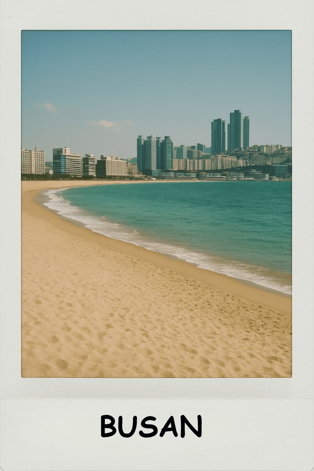 Polaroid photograph of Haeundae Beach in Busan showing golden sand, turquoise water, and modern skyline with coastal skyscrapers